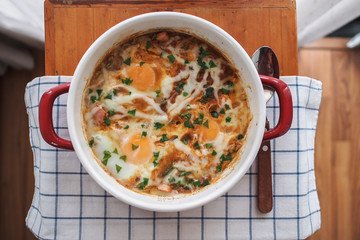 Shakshouka (Dish of eggs poached in a sauce of tomatoes)