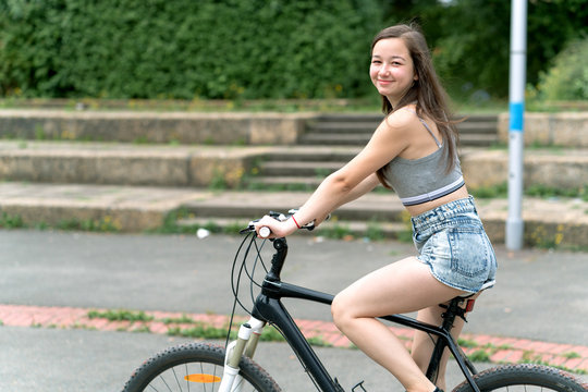 Girl Teenager On A Bicycle