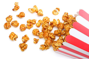 Popcorn in striped bucket isolated on white background