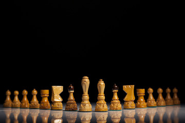 White chess pieces on a black background