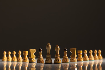 White chess pieces on a gray background