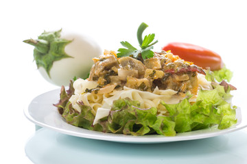 Boiled home-made noodles with gravy from eggplant