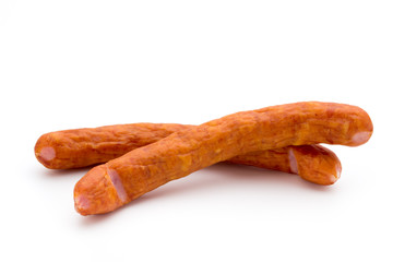 Stack of smoked sausages isolated on a white background.