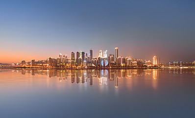 Fototapeta na wymiar Skyscrapers reflecting in the river