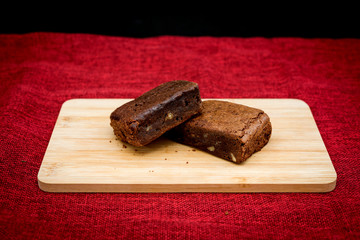Chocolate Brownie cake on a dark plate
