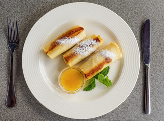 Pancakes stuffed with curd