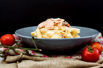 tasty pasta with salmon on a the table