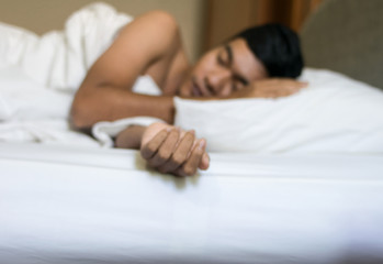 blurred of man sleeping on the bed