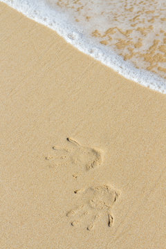 hand stamp on the sand