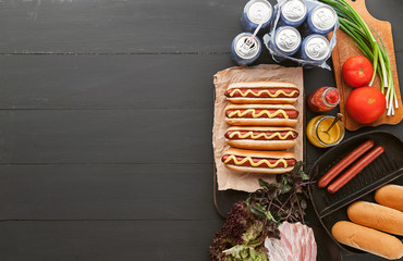 American hot dog with ingredients on a dark wooden background