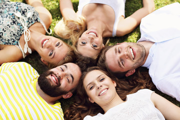 Friends group having fun together on grass