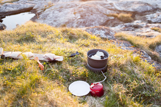 Cod cooks on a camp fire on the Lofoten islands, Norway