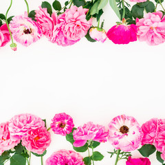 Floral wreath frame of roses, pink flowers and leaves isolated on white background. Flat lay, top view.
