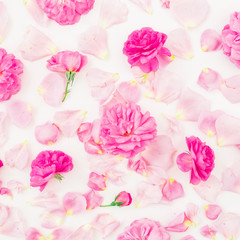 Floral pattern with pink roses and petals on white background. Flat lay, top view