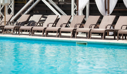 Comfortable chaise longues at resort