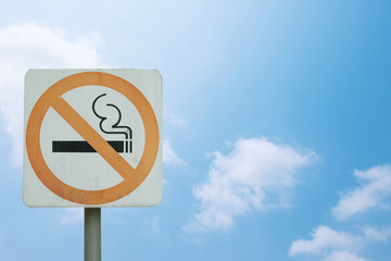Sign warned do not smoke area isolated on blue sky background with clipping path included