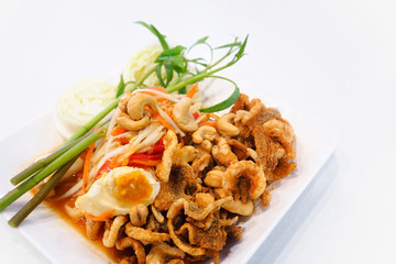 Papaya salad (somtum) with salted eggs and fried pork rind
