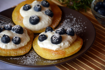 Fresh homemade pancakes with blueberries and cottage cheese.