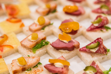 Cocktail snack with variety of ham sandwich for wedding party.