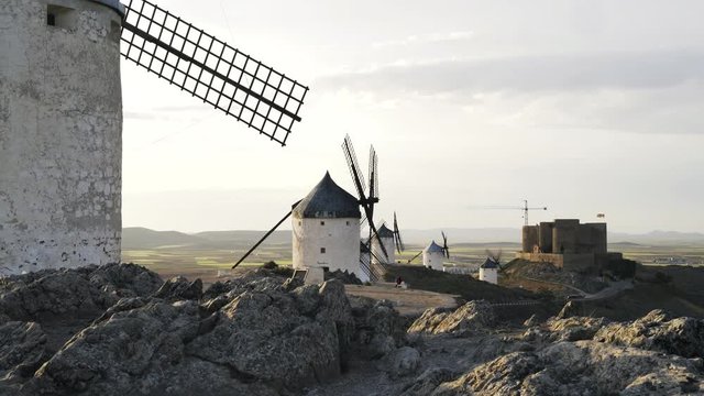 Windmills and a castle, Consuegra, Toledo province, Castilla la Mancha, Spain. Locked down time medium shot