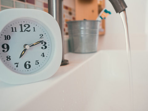 Concept Of Life Routine With Clock In The Bathroom.