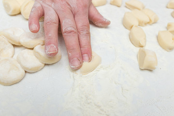 Cook cooks dough for pieces