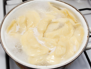 Vareniki with potatoes are cooked in a saucepan