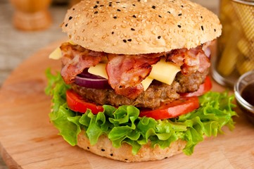 Bacon cheese burger with beef patty tomato onion