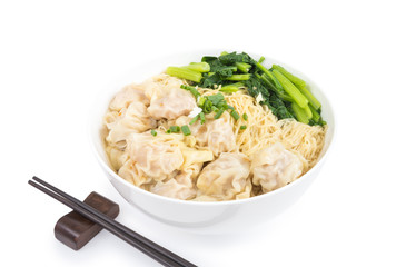 Wonton and egg noodle soup of Chinese Cantonese style for asian cuisine serving with Chinese cabbage (bog choy) and topped with chopped green onion isolated on white background