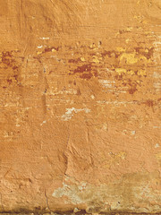 Old wall texture with traces of paint. Vertical image