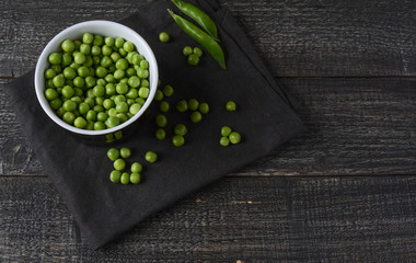 Peas. Fresh bio homemade peas and pods on old oak board. Healthy fresh green vegetable - peas and pods.