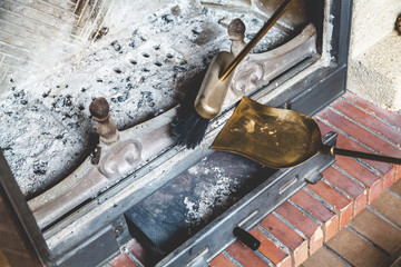 Cleaning fireplace with open tray.