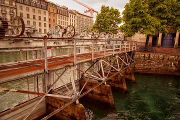 Wide shot of lake Geneva and lock during daytime against a dramatic sky, Switzerland