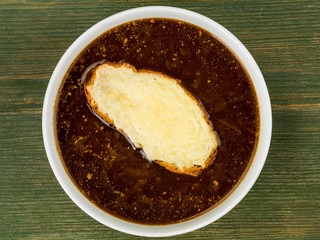 Bowl of French Onion Soup With Toasted Bread and Melted Cheese