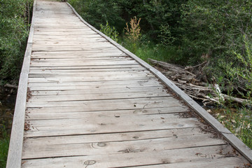 Weathered wooden bridge over Lightner Creek in Durango, Colorado