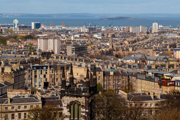 A telephoto shot of the Edinburgh downtown shot against a dramatic sky, Scotland, UK