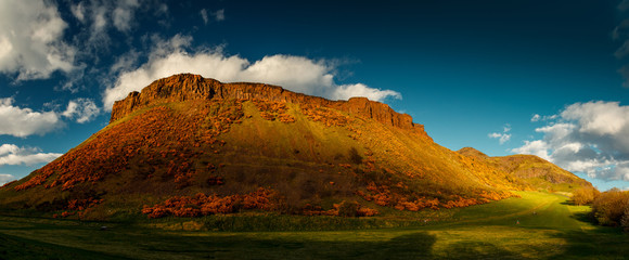 Panoramic shot of the Holyrood Park, Scotland, UK during golden hour sunset