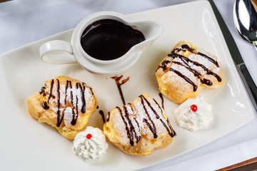 Eclairs with dark chocolate