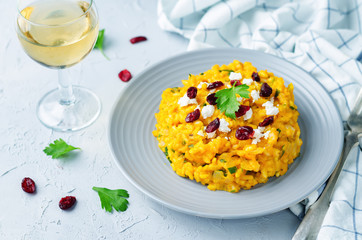 Pumpkin risotto with dried cranberries and goat cheese