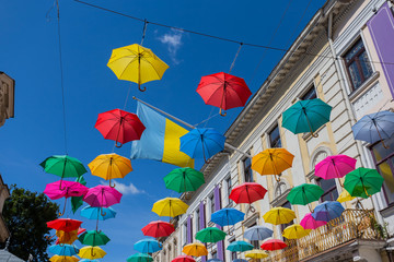Fototapeta na wymiar Lviv city street decorated by an varicolour umbrella