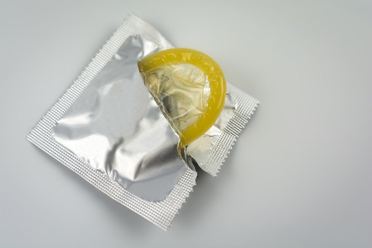 Condom close-up isolated. Contraceptive protection from pregnancy, AIDS.