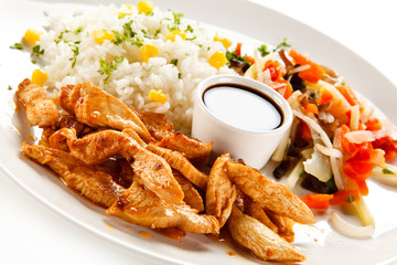 Chicken nuggets, white rice and vegetables