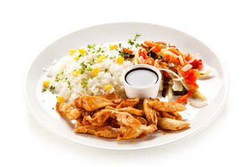 Chicken nuggets, white rice and vegetables