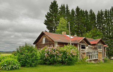 Traditional old half-ruined wooden house