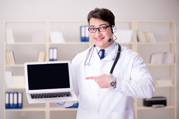 Young man doctor in medical concept