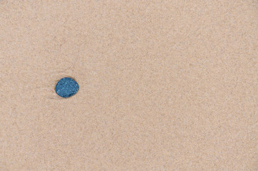 Fototapeta na wymiar small stone in sand beach