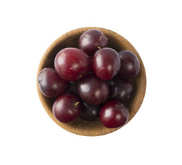 Bowl with plums isolated on white background. Ripe plums with copy space for text. Top view