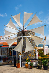 Old-style windmills used as touristic attraction on Lasithi Plateau. Crete, Greece