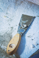 Metal building spatulas, closeup of mason tools