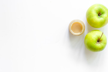 Apple puree for baby on white background top view copyspace